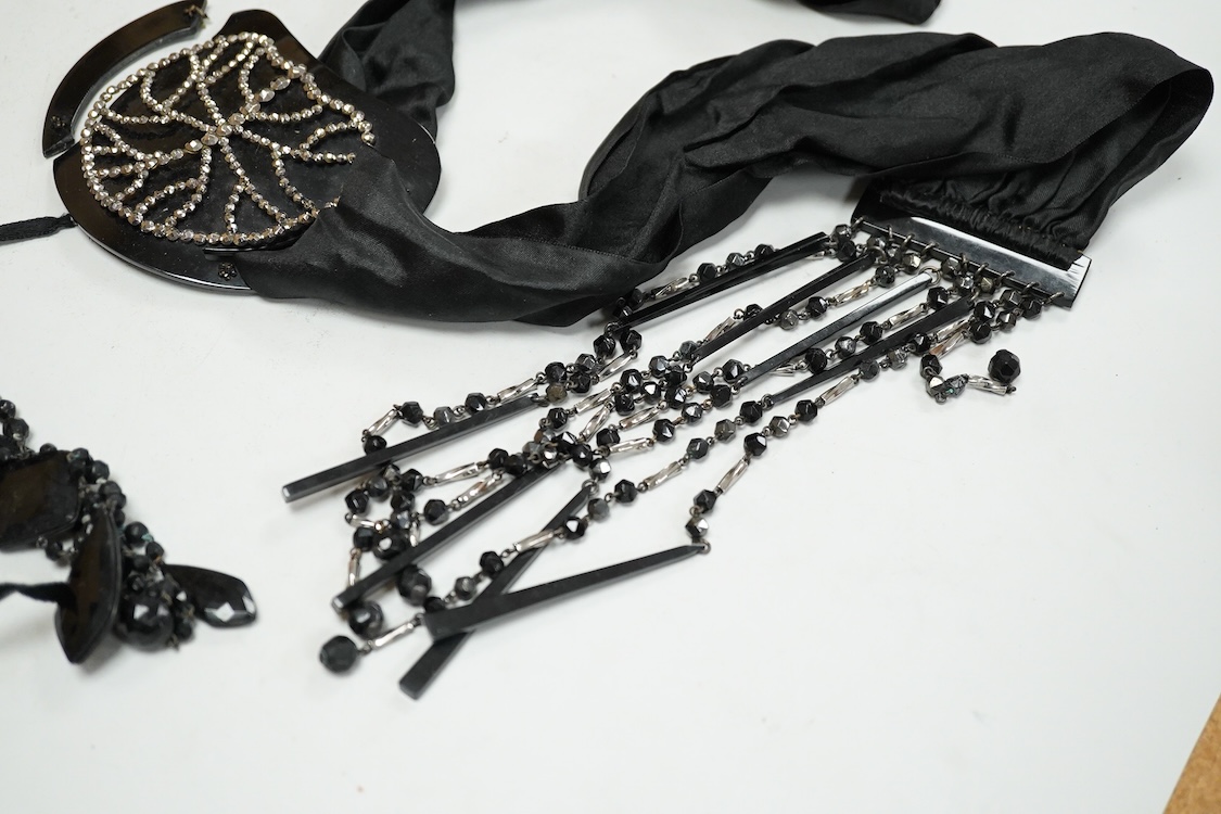 A quantity of assorted antique and later costume jewellery to include a silver and Marcasite ladies fob watch, a collection of cufflinks, brooches and a pair of drop earrings with screw backs
